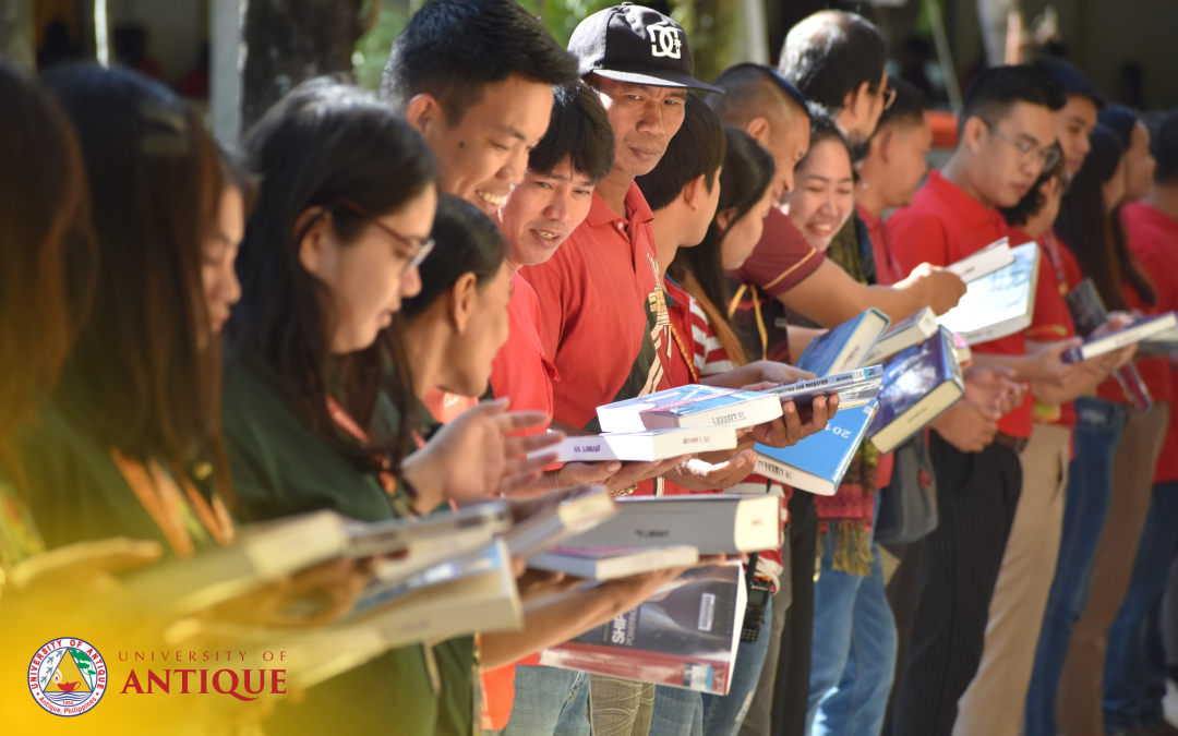 UA holds symbolic transfer of books